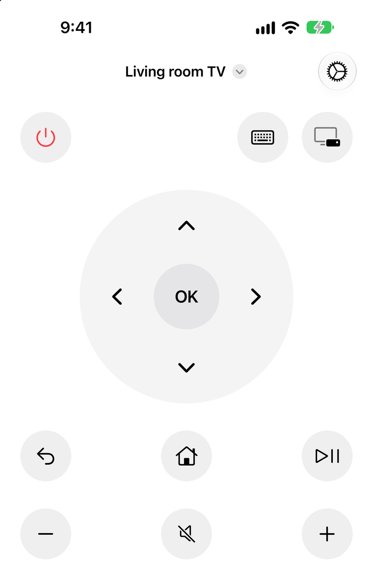 The tvM8 remote: power, keyboard and input buttons, a direction pad with OK, then back, home, play and pause, volume and mute.